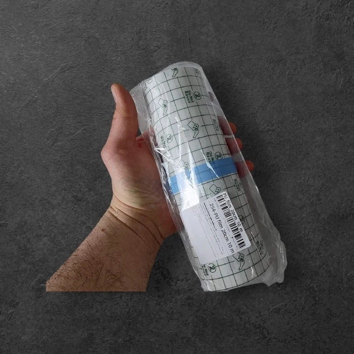 Vodoodporen obliž v roli 20cm x 10m za zaščito ran in tatoojev, Ljubljana, vodoodporen obliž, zaščita ran, zaščita tetovaže, prozoren obliž, elastičen povoj, močno lepilo, hitro celjenje, brez okužb, dolgotrajna zaščita, medicinski obliž, tattoo zaščita, hipoalergen obliž, nepremočljiv povoj, profesionalna nega kože